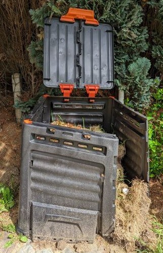 our compost bin which has burst open because of the lousy design.
